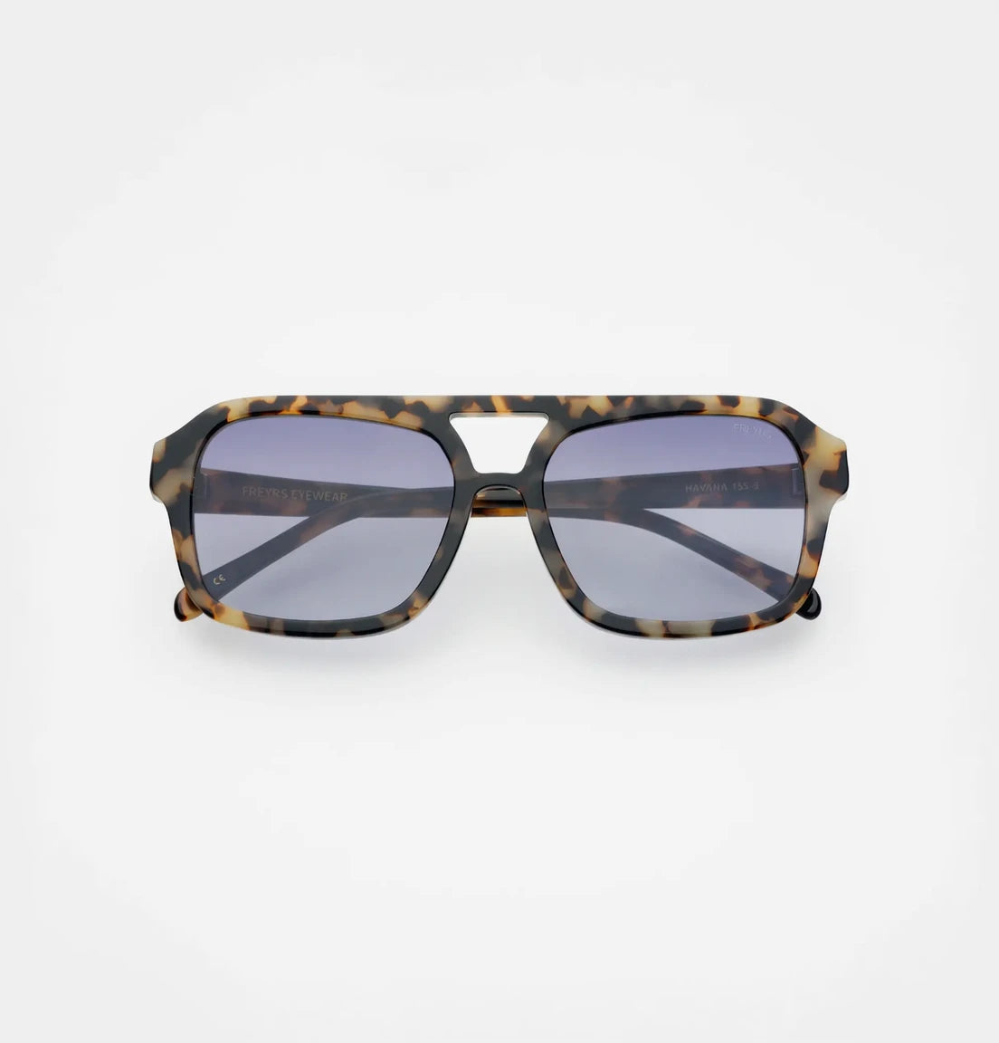 Sunglasses with tortoiseshell frame and purple lenses on a white background